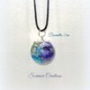Pendentif sphère inclusions fleurs