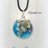 Pendentif sphère inclusions fleurs